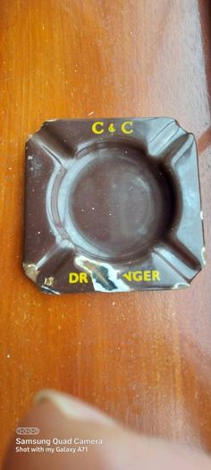 C & C Dry Ginger "ale" enamel metal ashtray ,dark brown,  very old vintage advertising ashtray, hard to come by ,collectors item,used condition  see pictures