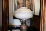 Brass oil lamp with art deco glass shade