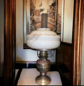 Brass oil lamp with art deco glass shade