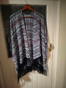 Dunne Stores, bohemian-style fringe kimono.