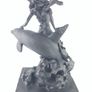 Girl sitting on a dolphin figurine Image 6