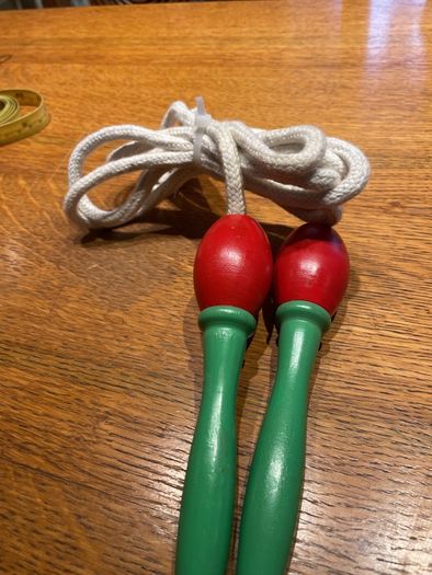 Vintage skipping rope with wooden handles