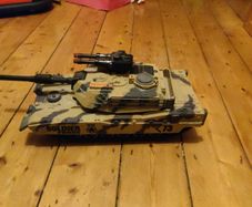 toy tank and army of toy soldiers