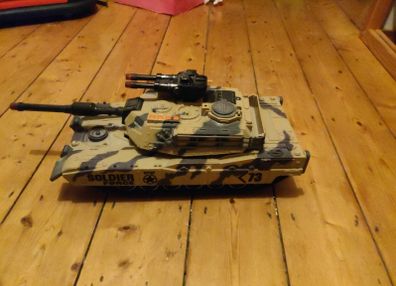 toy tank and army of toy soldiers