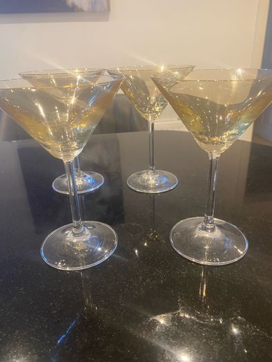 Set of four amber and plain glass martini or cocktail glasses
