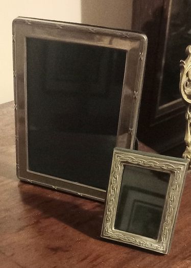 Two sterling silver picture frames.