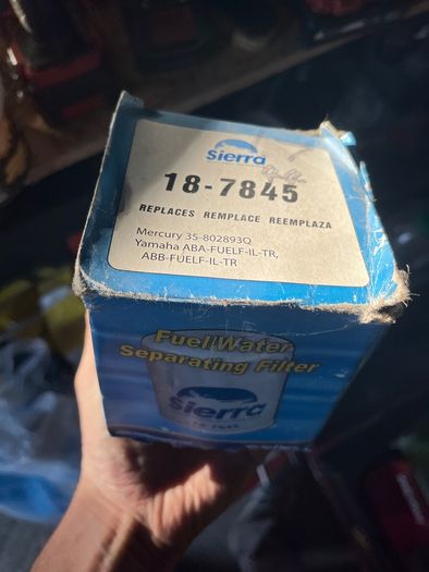Outboard motor fuel/water separating filter