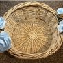 Wicker basket with artificial blue flowers. Image 7