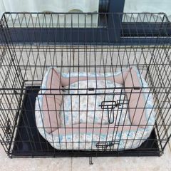 Dog cage and a crate bed