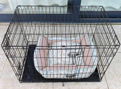 Dog cage and a crate bed