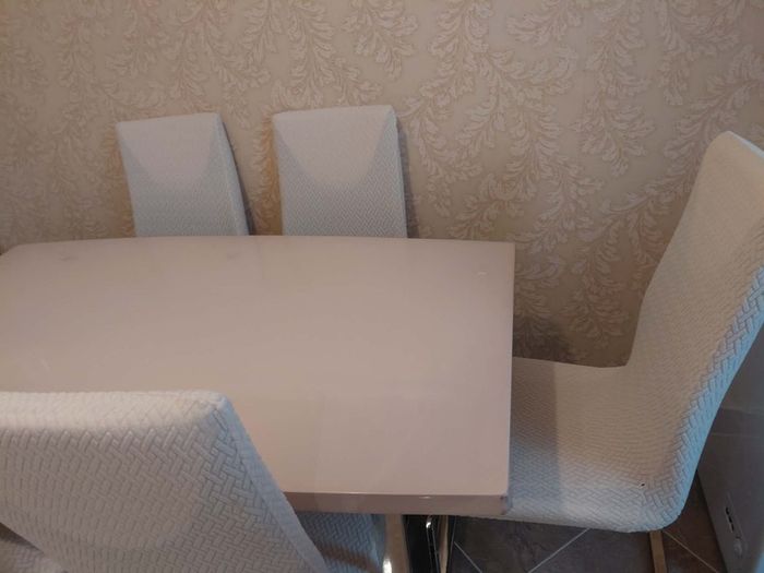 Glossy top Dining table with 6 chairs.