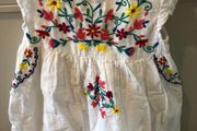White dress with colourful embroidery