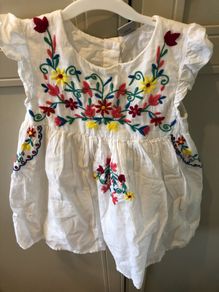 White dress with colourful embroidery