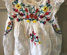 White dress with colourful embroidery