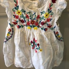 White dress with colourful embroidery