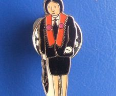 ORANGE ORDER (Ulster Loyalists) - a tictac badge showing a woman wearing an Orange Order outfit with sash (c.1980s)