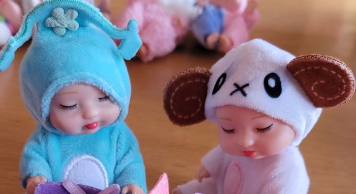 Mini baby dolls in sweet outfits