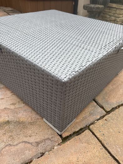 Rattan garden table with cushion