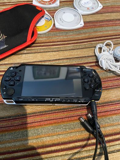 PSP  Console plus 10 games, charger and headphones