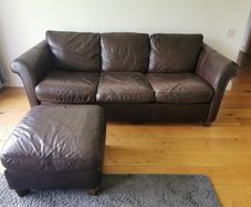 2 Leather couches (1 w/sofabed) & Pouf