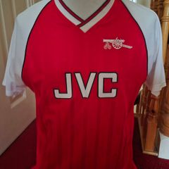Arsenal official score draw retro shirt.