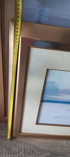 Two gold frame pictures with boats