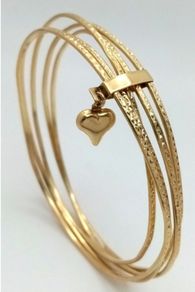 A 14K Yellow Gold Bangle Cluster Bracelet.