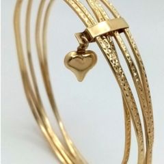 A 14K Yellow Gold Bangle Cluster Bracelet.