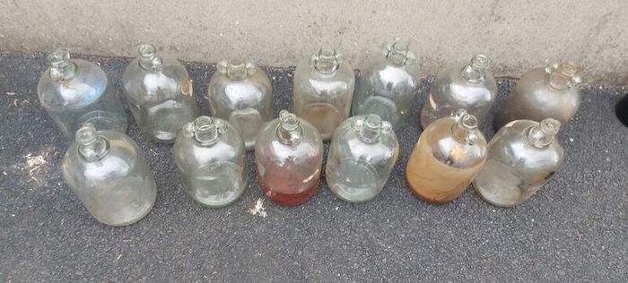 13 x demi johns,glass jars ,used condition, needs a clean,,buyer collects,,10 euros each or a deal  for the 13 ,sold as is