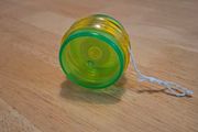 Green-yellow plastic yoyo