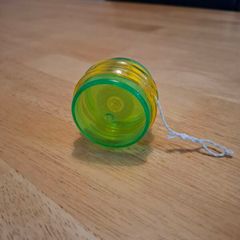 Green-yellow plastic yoyo
