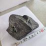 Face rock with green eyes hand carved Image 2