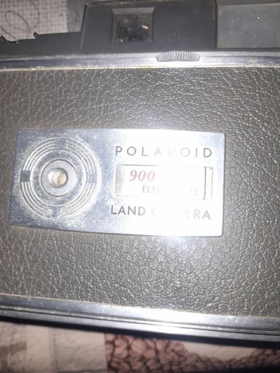 Vintage Large Polaroid Electric Eye Land Camera Model 900, Manufacture between 1960 and 1963. Key Features: Top of the line automatic shutter model featuring a folding bellows design and electric eye light metering