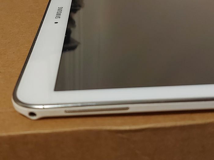 Samsung Galaxy Tab 4, Model SM-T530, 16GB, White, working great, in excellent condition and with a bunch of Family-children  movies
