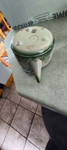 3 different items. No. 1- Mid-Century Porcelain Teapots, Japan, 1960.  95.00 euro. 2- VTG Hand Painted Le Poet Laval France Serving Plate 22.00 euro. 3- Vintage Short Dark Forest Green Ceramic 22.00 euro.