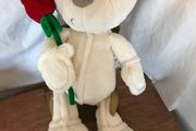 Soft White Teddy Bear holding a red rose