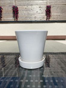 Pot with attached saucer