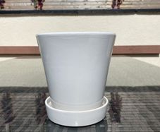 Pot with attached saucer