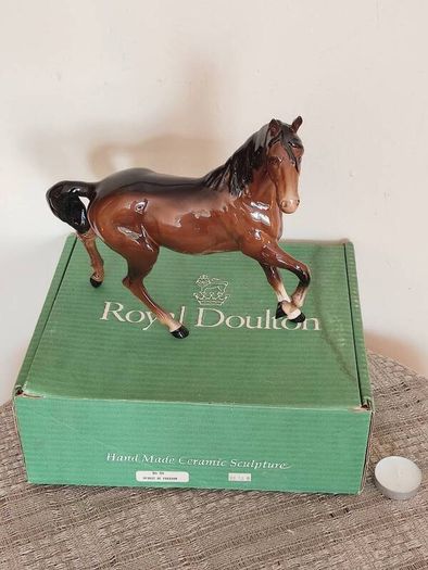 Vintage Royal Doultot porcelain horse. new in the box.