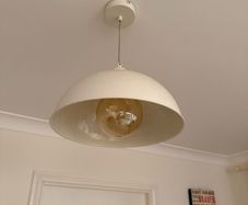 Cream pendant light fixture and large bulb