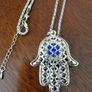 Hand with evil eye necklace and pendant Image 2