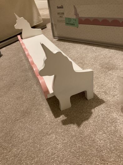 Pink and white unicorn shelves x2.