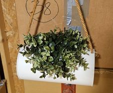 Fake plant in a hanging container