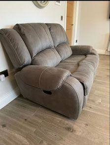 Two manual reclining two seater sofas