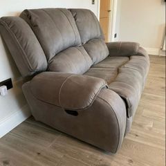 Two manual reclining two seater sofas