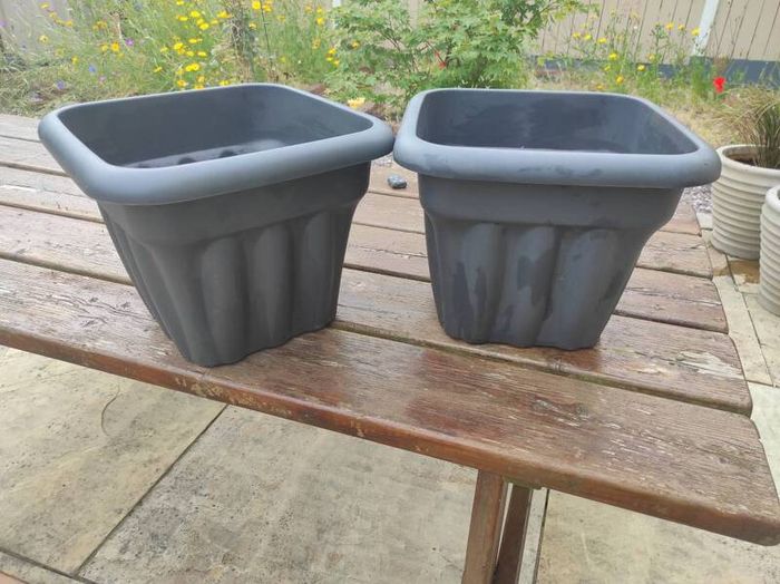 two plastic planters