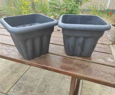 two plastic planters