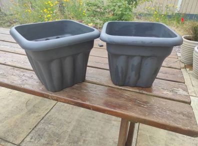 two plastic planters