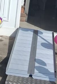 Folding wheelchair ramp