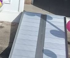 Folding wheelchair ramp